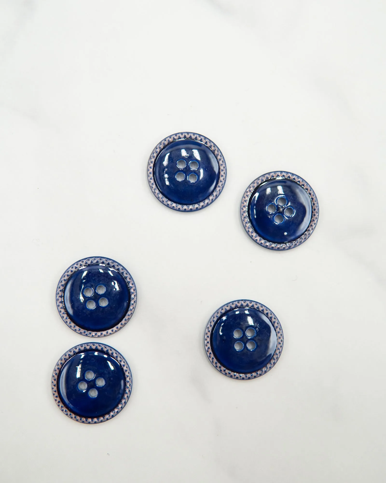 Glossy pale river shell buttons with textured edge