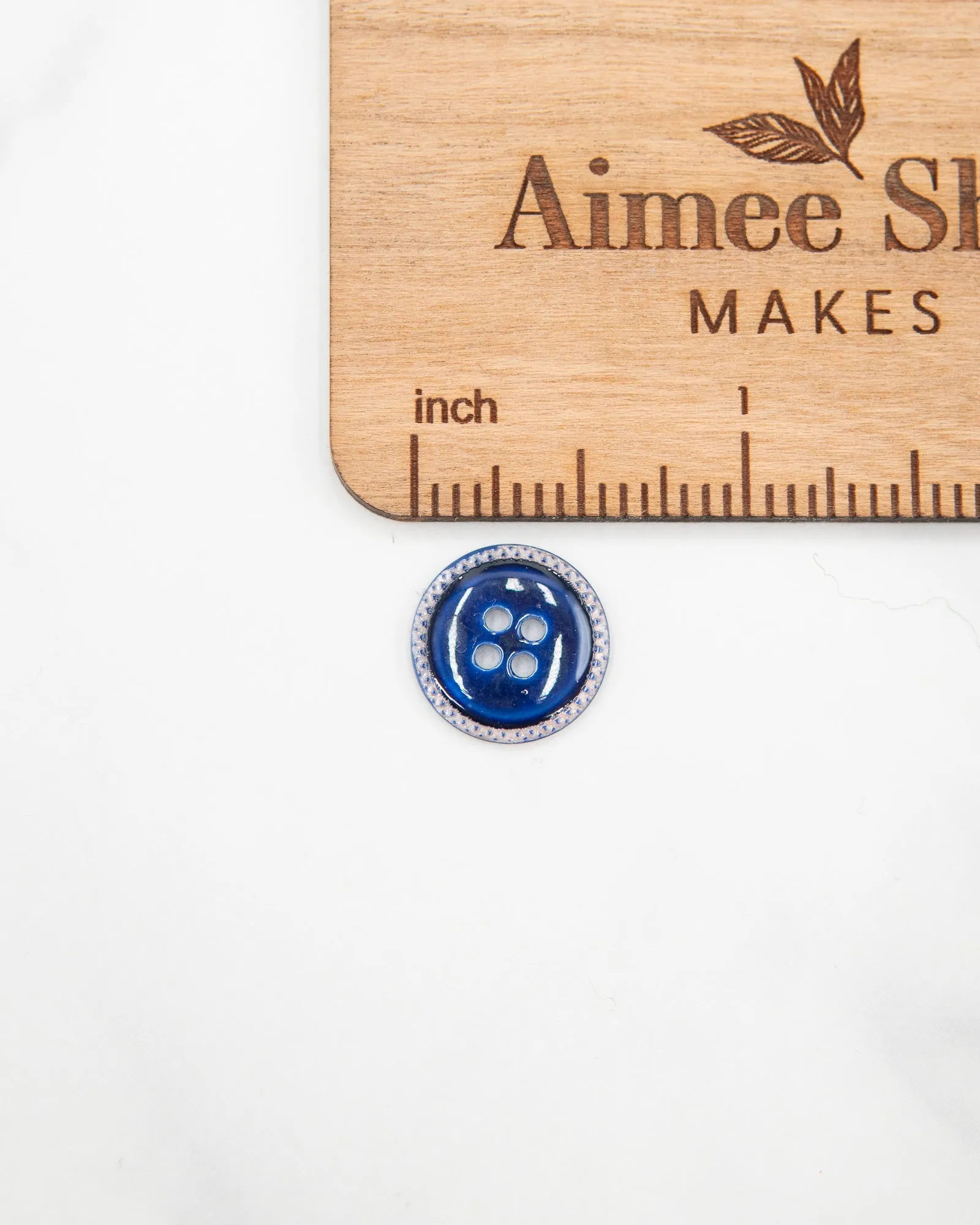 Glossy pale river shell buttons with textured edge